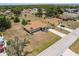 Aerial view showcasing two homes with driveways, side yards, and mature trees at 2365 Nuremberg Blvd, Punta Gorda, FL 33983