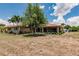 Expansive backyard showcasing the home's screened patio and lush surroundings at 2365 Nuremberg Blvd, Punta Gorda, FL 33983