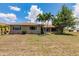 Well-maintained backyard featuring palm trees and landscaping at 2365 Nuremberg Blvd, Punta Gorda, FL 33983