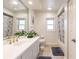 Bright bathroom featuring a large mirror, marble shower curtain, and ample countertop space at 2365 Nuremberg Blvd, Punta Gorda, FL 33983