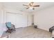 Bright bedroom with a ceiling fan, closet and light colored wood flooring at 2365 Nuremberg Blvd, Punta Gorda, FL 33983