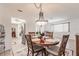 Open concept to the kitchen and dining area with stainless steel appliances and natural lighting at 2365 Nuremberg Blvd, Punta Gorda, FL 33983