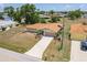Exterior of a well-maintained house featuring a long driveway and manicured landscaping at 2365 Nuremberg Blvd, Punta Gorda, FL 33983