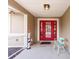 Inviting front porch features double red doors and a decorative patriotic statue at 2365 Nuremberg Blvd, Punta Gorda, FL 33983