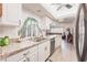 Bright kitchen with a skylight and plenty of counter space overlooks the living area at 2365 Nuremberg Blvd, Punta Gorda, FL 33983
