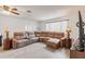 Inviting living room with modern sectional sofa, stylish lighting, and wood-look flooring at 2365 Nuremberg Blvd, Punta Gorda, FL 33983