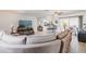 Comfortable living room with entertainment center and open floor plan to kitchen and patio at 2365 Nuremberg Blvd, Punta Gorda, FL 33983