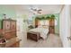 Spacious main bedroom with wood-look floors, decorative plants and a decorative headboard at 2365 Nuremberg Blvd, Punta Gorda, FL 33983