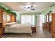 Bright main bedroom showing closet and dresser space with wood-look flooring at 2365 Nuremberg Blvd, Punta Gorda, FL 33983
