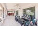 Large screened patio with multiple seating areas and access to the backyard at 2365 Nuremberg Blvd, Punta Gorda, FL 33983