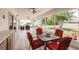 Relaxing screened patio with comfortable seating, ceiling fans, and outdoor dining area at 2365 Nuremberg Blvd, Punta Gorda, FL 33983