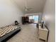 Inviting living room with tile flooring, a ceiling fan, and a sliding glass door to the outside at 25188 Marion Ave # 1, Punta Gorda, FL 33950