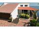 Waterfront home with a red tile roof offers an attached garage, mature landscaping, and a private outdoor patio at 25188 Marion Ave # 1, Punta Gorda, FL 33950