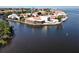 Waterfront home with a red tile roof features an enclosed porch, back patio and beautiful views of the waterway at 25188 Marion Ave # 1, Punta Gorda, FL 33950