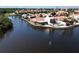 Waterfront home with a red tile roof features an enclosed porch, back patio and beautiful views of the waterway at 25188 Marion Ave # 1, Punta Gorda, FL 33950