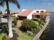 Lovely waterfront home with red tile roof features mature landscaping, private drive, and easy access to the open bay at 25188 Marion Ave # 1, Punta Gorda, FL 33950