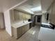 Bright kitchen with stainless steel appliances, white countertops, and ample cabinet space at 25188 Marion Ave # 1, Punta Gorda, FL 33950