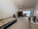 Inviting living room with tile flooring, a ceiling fan, and a sliding glass door to the outside at 25188 Marion Ave # 1, Punta Gorda, FL 33950