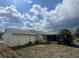 The house has a cozy screened in porch in the backyard, perfect for entertaining at 2696 Gisela Rd, North Port, FL 34287