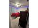 Cozy carpeted bedroom with a ceiling fan and unique accent lighting at 2696 Gisela Rd, North Port, FL 34287