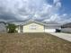 Charming single-story home with attached garage, neat landscaping, and inviting curb appeal at 2696 Gisela Rd, North Port, FL 34287