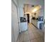 The kitchen features a walk-in pantry, white appliances, and ample counter space at 2696 Gisela Rd, North Port, FL 34287