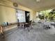 Enclosed patio area with sliding glass doors, offering a view of the outdoors at 2696 Gisela Rd, North Port, FL 34287