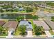 Aerial view of a home with a two car garage and well-maintained landscaping at 2747 Suncoast Lakes Blvd, Punta Gorda, FL 33980