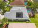 Aerial view showcasing the home's screened-in pool and solar panels at 2747 Suncoast Lakes Blvd, Punta Gorda, FL 33980