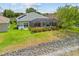 The landscaped backyard with screened lanai at 2747 Suncoast Lakes Blvd, Punta Gorda, FL 33980
