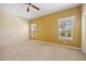 Spacious bedroom with carpet flooring, natural light, and pool views from two windows at 2747 Suncoast Lakes Blvd, Punta Gorda, FL 33980