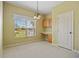 Dining area features a window with views, built-in desk, and cabinetry for added storage at 2747 Suncoast Lakes Blvd, Punta Gorda, FL 33980