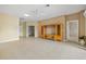 Open concept living area features neutral walls, tile floors, and seamless transitions into adjacent spaces at 2747 Suncoast Lakes Blvd, Punta Gorda, FL 33980