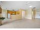 Bright, open living space connects to the kitchen, featuring neutral walls, tile floors, and a welcoming atmosphere at 2747 Suncoast Lakes Blvd, Punta Gorda, FL 33980