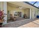 The patio features two lounge chairs, brick pavers, and a ceiling fan at 2747 Suncoast Lakes Blvd, Punta Gorda, FL 33980