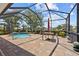 Spacious lanai featuring a pool, brick pavers, and outdoor seating area at 2747 Suncoast Lakes Blvd, Punta Gorda, FL 33980
