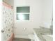 The bathroom features white walls, granite countertop, modern fixtures, a frosted window, and a shower curtain at 2858 Parlay Ln, North Port, FL 34286