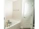 Bathroom featuring a soaking tub with a shower head and chrome fixtures at 2858 Parlay Ln, North Port, FL 34286
