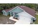 Charming single-Gathering home featuring a well-maintained yard, covered entryway, and attached two-car garage at 2858 Parlay Ln, North Port, FL 34286