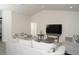 Inviting living room featuring modern furniture, a TV, and ample space for relaxing and entertaining at 2858 Parlay Ln, North Port, FL 34286