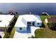 Aerial view of the charming waterfront home with an adjacent dock and beautiful waterway views at 3772 Peace River Dr, Punta Gorda, FL 33983