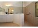 Bathroom featuring double sink, large mirror and large walk in shower at 3772 Peace River Dr, Punta Gorda, FL 33983