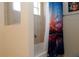Bathroom features a shower/tub combo and themed curtain art at 3772 Peace River Dr, Punta Gorda, FL 33983
