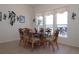 The dining area has a glass table and seating for six, with a clear view of the river and outdoor space at 3772 Peace River Dr, Punta Gorda, FL 33983