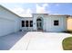 Charming coastal home featuring a light blue exterior with white trim and an arched entry at 3772 Peace River Dr, Punta Gorda, FL 33983
