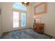 Inviting foyer with a decorative glass door, arched transom window, and stylish decor at 3772 Peace River Dr, Punta Gorda, FL 33983