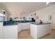Bright kitchen with white cabinets, blue countertops and modern appliances, offering ample space for cooking and entertaining at 3772 Peace River Dr, Punta Gorda, FL 33983