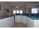 Bright kitchen featuring ample counter space, bar seating, and an open layout at 3772 Peace River Dr, Punta Gorda, FL 33983
