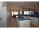 Spacious open concept kitchen with modern white cabinets, island, and natural light at 3772 Peace River Dr, Punta Gorda, FL 33983