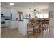 Bright and airy kitchen featuring white cabinetry and tile flooring at 3772 Peace River Dr, Punta Gorda, FL 33983